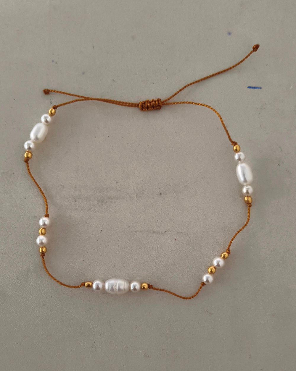 White Pearl Bracelet on thread with Gold plated Beads