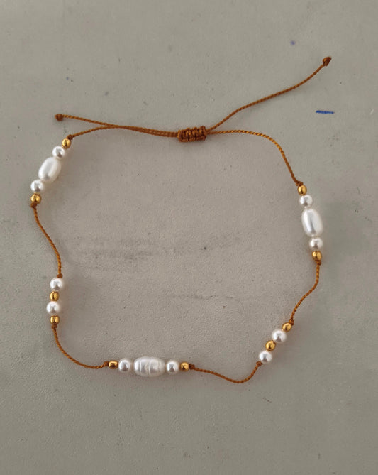 White Pearl Bracelet on thread with Gold plated Beads