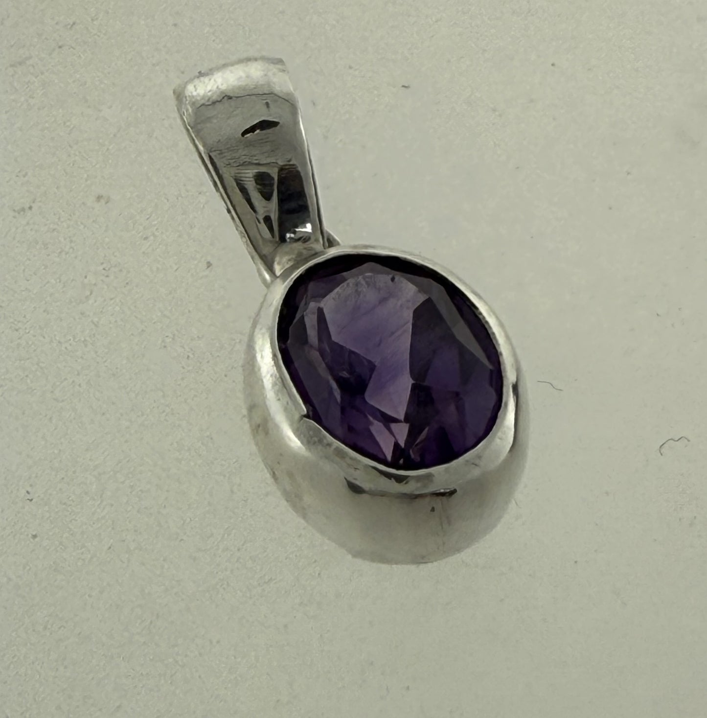 PA103    Amethyst Faceted 9x6mm Oval Pendant