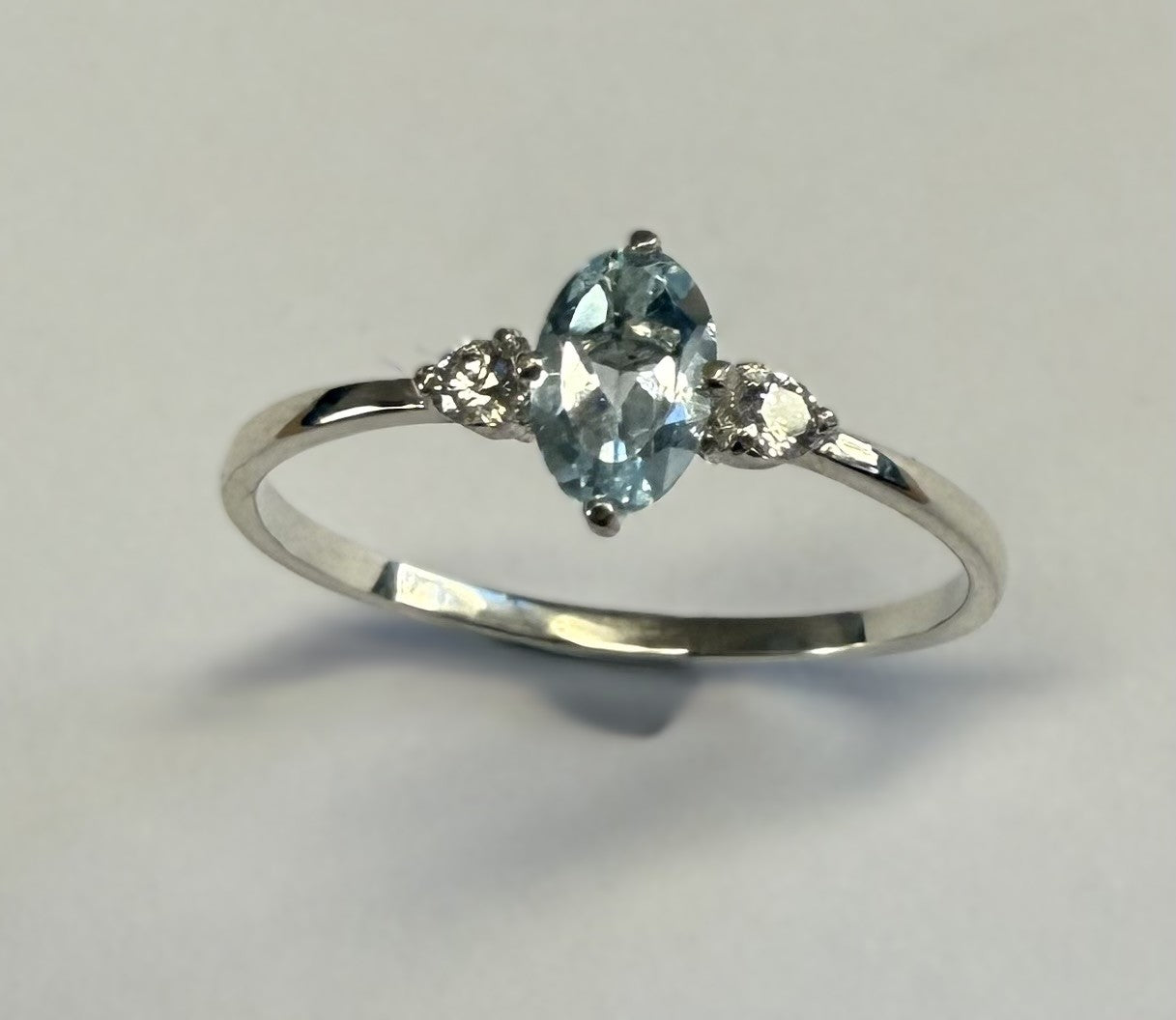 RBT100S      Blue Topaz Facet 6x4mm & CZ Ring